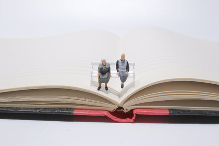 the mini old man seat on the wooden benchの写真素材