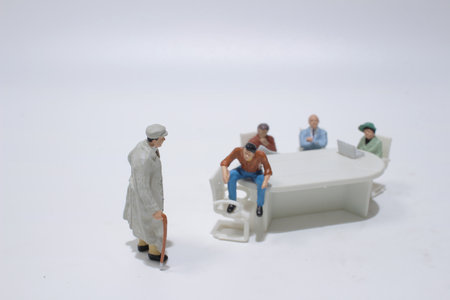 figure of business people negotiating at meeting tableの写真素材