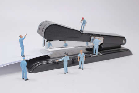 the mini of group worker with the staplerの写真素材