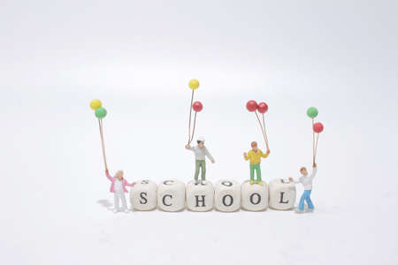 the fun of kids figure stand on the cubeの写真素材