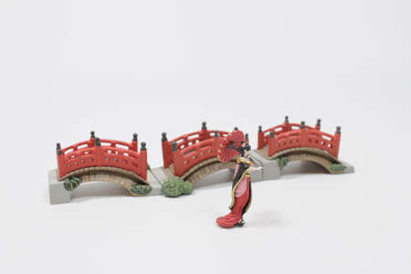 Geisha with umbrella on a white back groundの写真素材