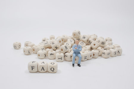 a Small plastic figure with  the FAQ blocksの写真素材