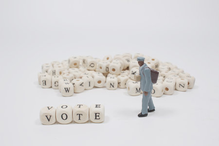 The word vote on wooden cube block with figureの写真素材