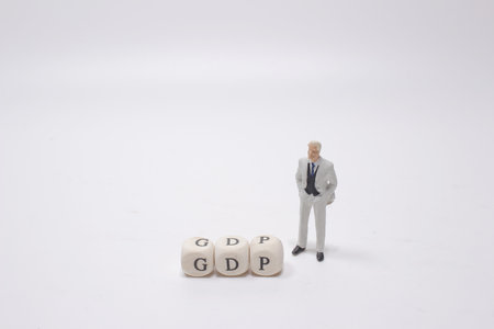 A GDP word written on wood block, with the figureの写真素材