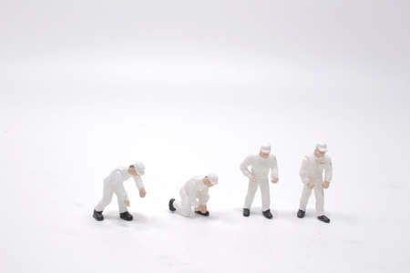 mini people worker holding tool on white backgroun