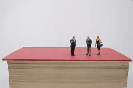 group of the small business figure on the red bookの写真素材