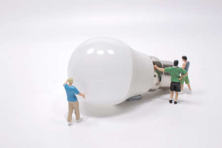 a Business creative idea, power or energy generator concept, miniature peopleの写真素材