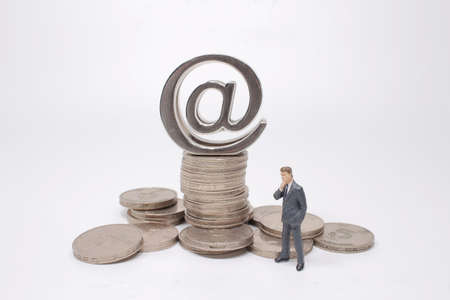 the mini model figures making decision on coins stacks.