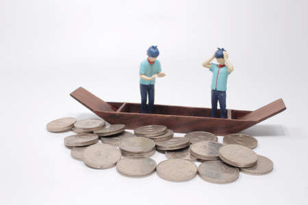 Ship made of wood with figure bill on coins, the finance problem