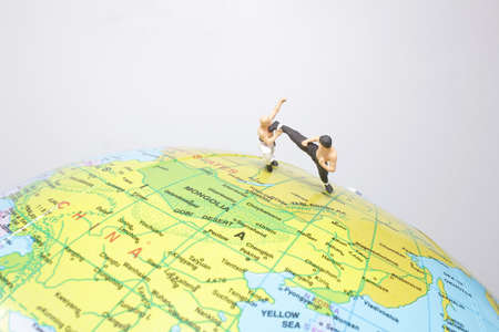 Kung fu figure fighting on the earthの写真素材