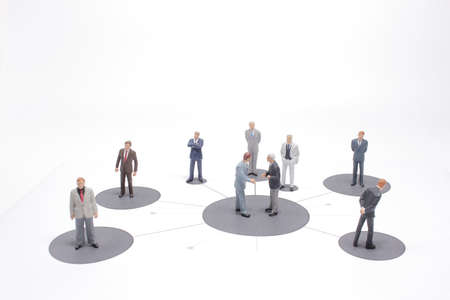 close up of miniature people with social network diagram on openの写真素材