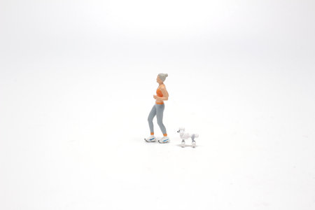 jogging with pet: figure runs together with dogの写真素材