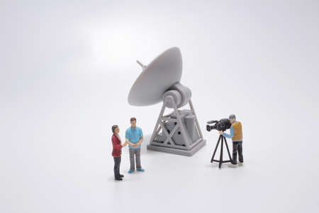 the TV reporter presenting the news, with Satelliteの写真素材