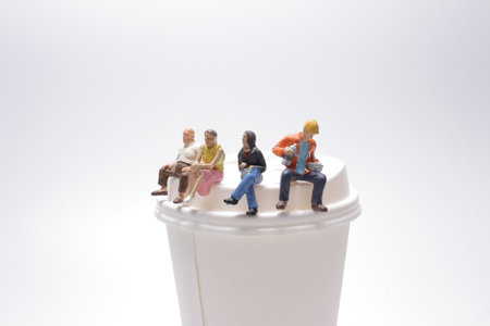 Miniature business team having a coffee breakの写真素材