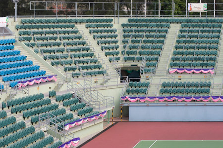 Empty stands of a stadium with empty seats