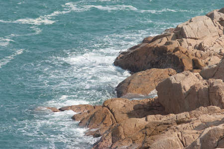 the big waves and dark rock in stormy sea Po Toi Islandsの写真素材