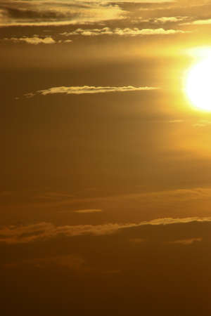 Beautiful sunset sky above clouds with dramatic light.の写真素材