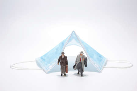 Businessman miniature figure people standing under surgicalの写真素材