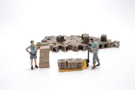 the cube of text bye with the worker figureの写真素材