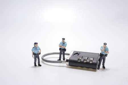 the police with metal security lock keyの写真素材