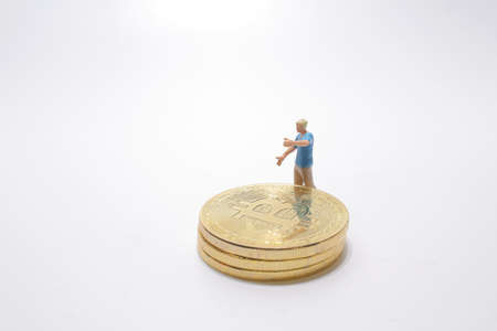 the mini figure with the bitcoin on boardの写真素材
