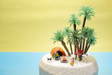 the mini figure enjoy the holiday at Young coconutの写真素材