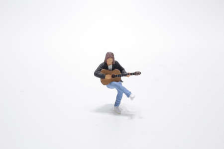 the mini of fun figure playing Guitarの写真素材