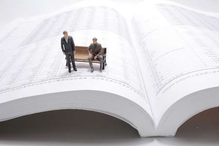 the mini figure are meeting on the financial reportの写真素材
