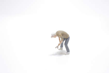 mini people engineer worker construction concept on white backgroundの写真素材