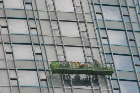 15 may 2005 Boston Skyline syscraper group workers cleaning windows serviceのeditorial素材