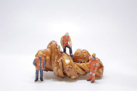 Miniature figure concept of construction worker, Food, Business concept.