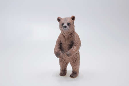 Miniature figure of a toy bear, isolate on a white background.の写真素材