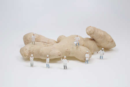 mini chef on the Ginger root isolated on white back ground