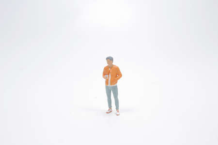 different poses of the mini figure at the white back groundの写真素材