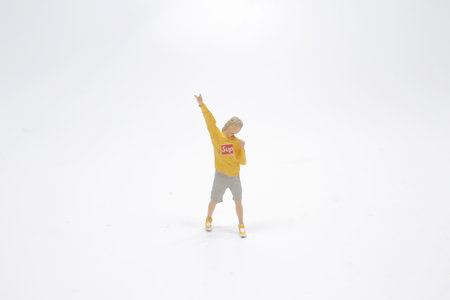 different poses of the mini figure at the white back groundの写真素材