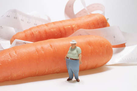 a Fat man figure with finger at carrot