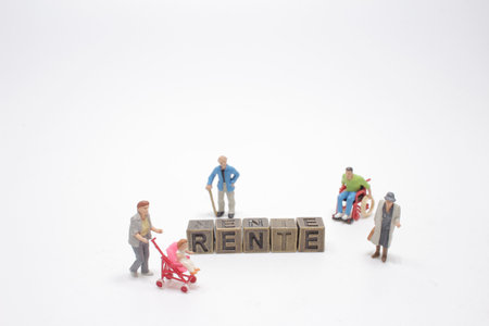 The figures of people with the german word rente metal cubeの写真素材