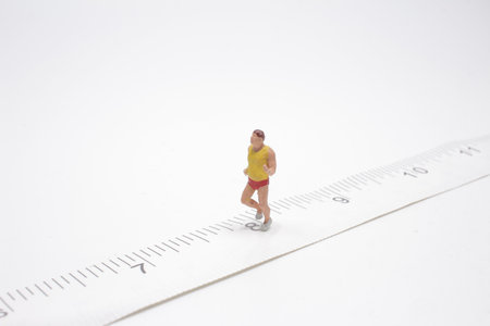 Sport and fitness concept. Close up of man runner miniature figure people runningの写真素材