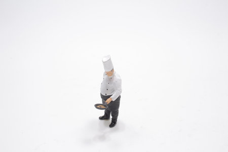 a tiny of Chef stand on the whiteの写真素材