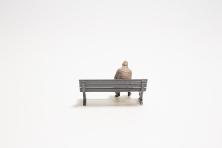the mini business man, sitting on the benchの写真素材