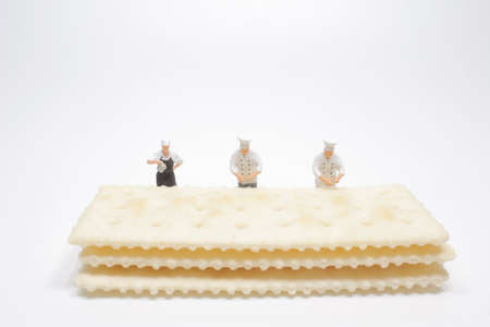 a fun of mini Chef making biscuit at white boardの写真素材