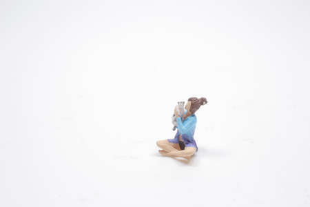 the mini of woman smiling and playing with catの写真素材