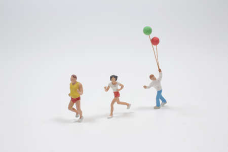 mini people happy family running and playing with balloon