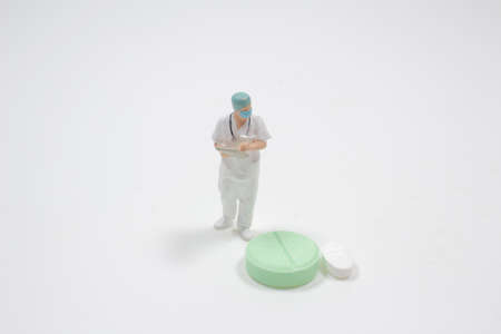 Doctor holds the report with pill . Medical conceptの写真素材