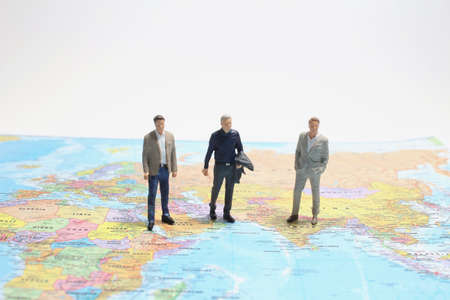 mini citizen figure greeting other on word map