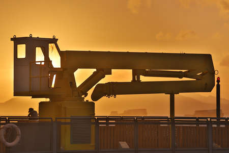 Yellow crane , at the sun set time, hong kong