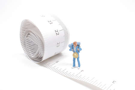 the fun of Mini hiker figure on a tapeの写真素材
