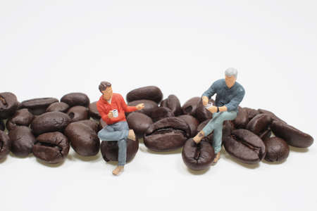 mini figure sit on the coffee Beans