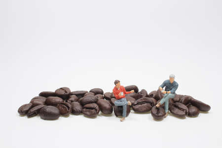 mini figure sit on the coffee Beans