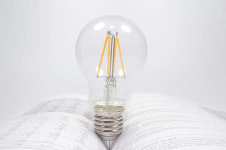 a bulb on open book. Idea or creativity concep